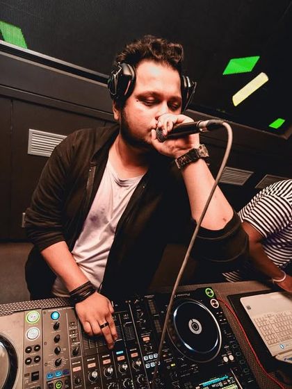 On the mic, wishing everyone a Happy New Year. A shot that shows my role as an MC and party host.