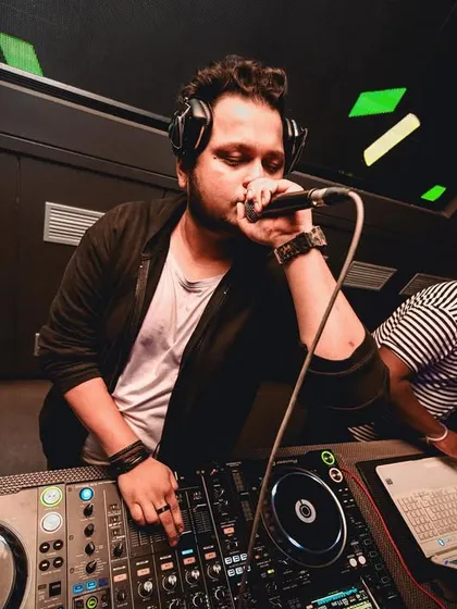 On the mic, wishing everyone a Happy New Year. A shot that shows my role as an MC and party host.