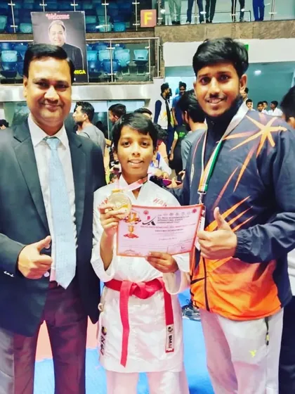 Sharing a proud moment with a gold medal winner. His performance shows the effectiveness of our focused competition training.
