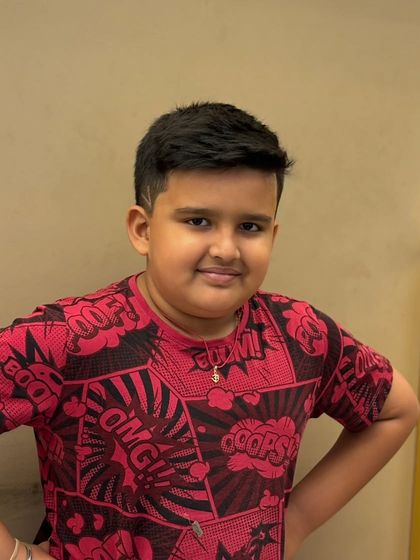 A fresh and confident haircut for a young client, showing that great style starts at any age.