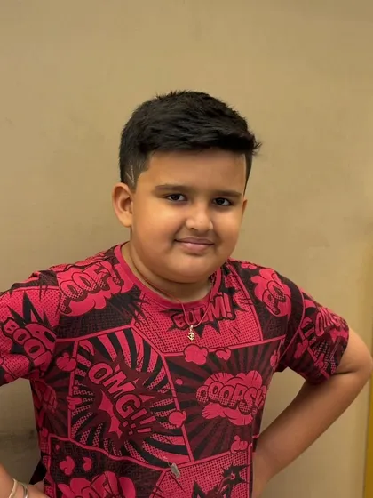 A fresh and confident haircut for a young client, showing that great style starts at any age.