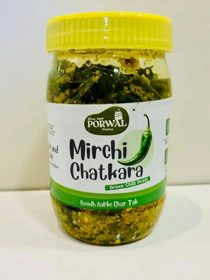 A jar of my Mirchi Chatkara green chilli pickle. It is perfect for adding a spicy kick to your meals, and it is completely homemade and natural.
