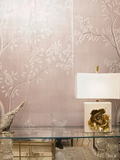 A closer view of the metallic wallpaper at Sitananda, showing the fine details of the branches and blossoms against the shimmering, textured background.