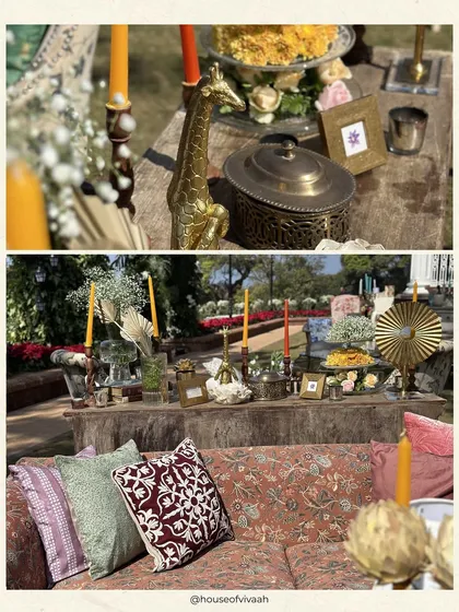 A collage of eclectic and rustic table decor, featuring a mix of brass animal figurines, colorful candles, and vintage containers, creating a layered and personal feel.