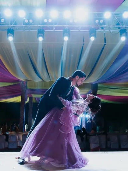 The first dance at a Sangeet ceremony, captured under the stage lights. I know how to work with challenging lighting to freeze these fast-moving, romantic moments, ensuring the couple's performance is beautifully preserved.