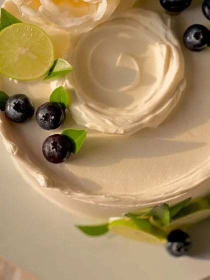 My most popular creation, the signature Italian Lemon & Blueberry cake. I offer many design variations, all featuring fresh blueberries, zesty lime, and smooth buttercream.