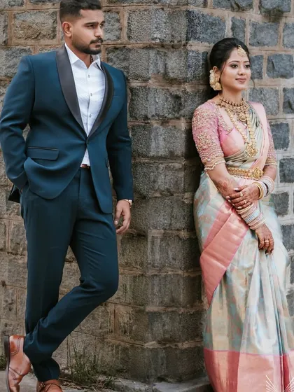 A stylish couple shot from the engagement. Nivedha's traditional jewellery provides a beautiful contrast to her partner's modern suit.