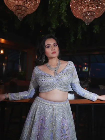 This pose highlights the beautiful diamond jewelry and how the makeup complements it without competing.