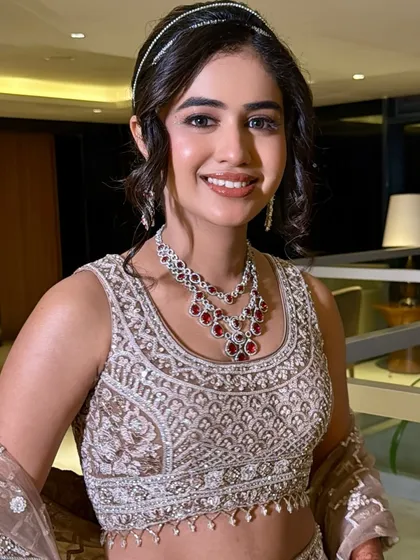 The makeup was designed to photograph beautifully under lights and movement, perfect for a sangeet celebration.