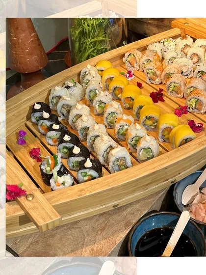 Our Sushi Boat is a showstopper. We carefully arrange a variety of freshly made sushi rolls on a beautiful wooden boat, served with soy sauce, wasabi, and pickled ginger. It's perfect for adding a touch of elegance to your event.