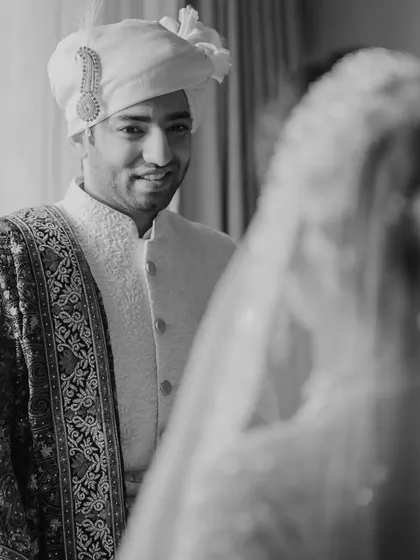 The groom's reaction upon seeing his bride for the first time on their wedding day, a moment of pure love and admiration captured forever.