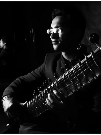A black and white photo with my reflection in the background, taken during a tour in Russia.