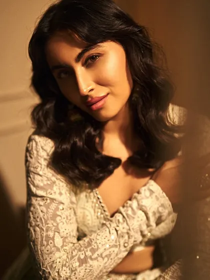 A soft and dreamy close-up of Khatija Iqbal. The makeup is blended to perfection, creating a look that is both stunning and natural.