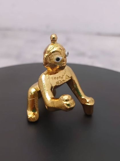 A charming Panchaloham baby Krishna idol. This crawling Krishna, or Laddu Gopal, is perfect for your home shrine and makes a wonderful gift.
