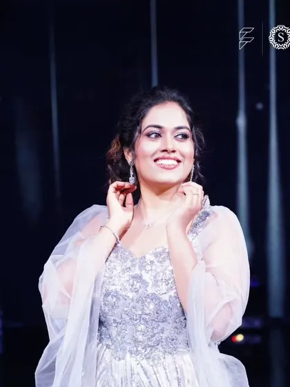 Another beautiful shot of Sayli Kamble in our silver gown, showing how it catches the stage lights. Perfect for anyone who wants to be in the spotlight.