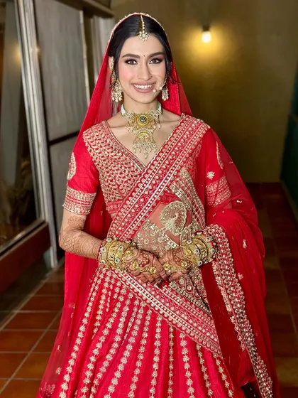The bride, ready for her big moment. Her smile says it all, and her makeup is the perfect complement to her joyful energy.