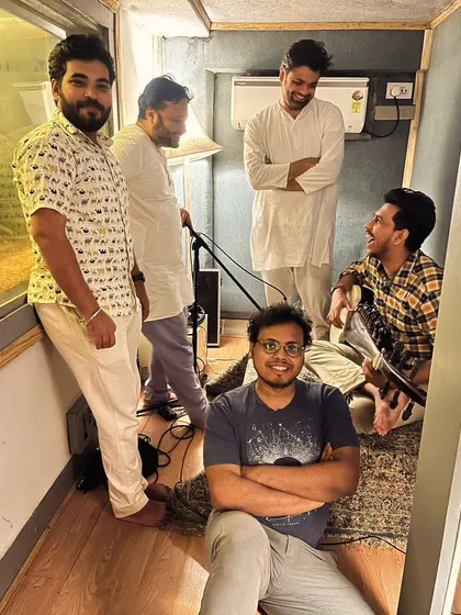 Another glimpse into our late-night session. The camaraderie and shared focus in the studio are essential for creating cohesive and heartfelt music.