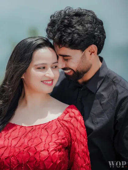 A tight, intimate close-up of a couple sharing a happy, natural smile. This photo perfectly captures the candid, in-between moments that are the heart of my photography style.