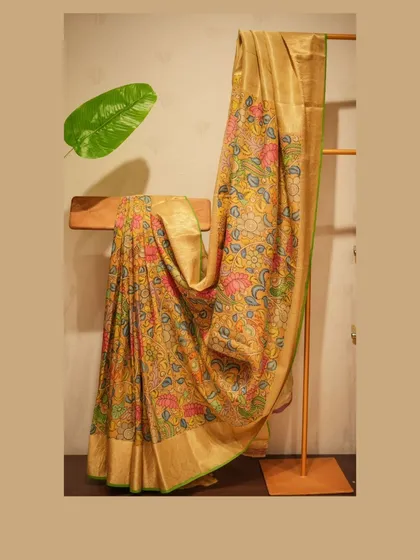 Artistry in every drape. This Tussar silk saree features exquisite, hand-painted Kalamkari art, blending traditional storytelling with timeless elegance. It is a wearable masterpiece for the modern connoisseur.