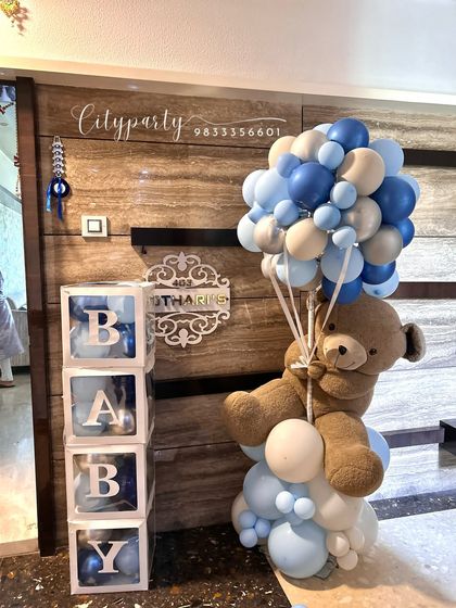 A balloon bouquet and 'BABY' blocks arrangement, perfect for placing in the entryway or living room for a welcome home celebration.