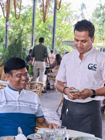 A happy customer interacting with my staff. I pride myself on friendly, attentive service that makes you feel right at home.