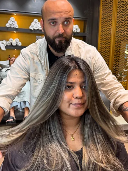 A full view of this ash blond hair transformation, showing the dramatic change and beautiful new tone.