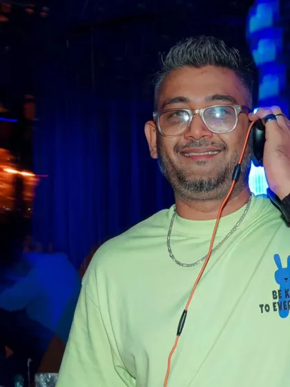 A happy, relaxed photo of me behind the decks. I am always comfortable and in my element when I am performing.