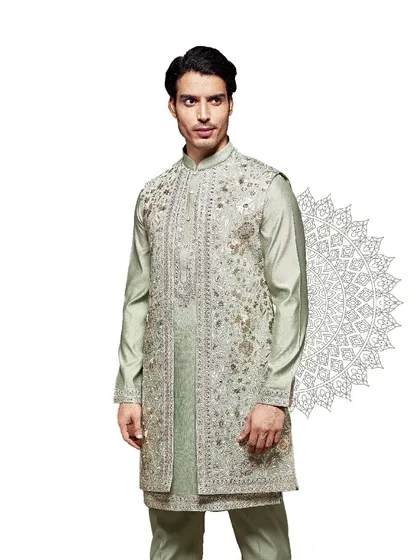 Grace in every detail. This pastel green kurta is adorned with a heavily embroidered jacket, creating a look of soft, ethereal elegance perfect for a day ceremony.