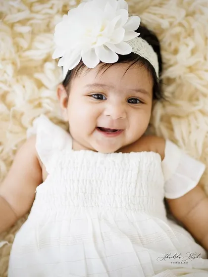 A beautiful, happy smile from this little one. Capturing these joyful expressions is what makes baby photography so rewarding.