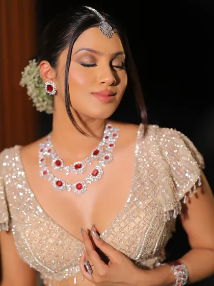 A close-up of the creative halo eye look. The eyes are closed to show the placement of the shimmer and the soft blend of the surrounding colors.