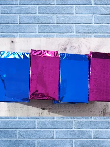 The wallets are packaged in shiny, colorful foil bags, making them an exciting little present to open.