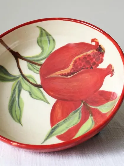 This hand-painted pomegranate bowl is a piece of functional art, bringing vibrant color and traditional motifs to your table. I shape and paint each one by hand, making it a truly one-of-a-kind treasure for your home.