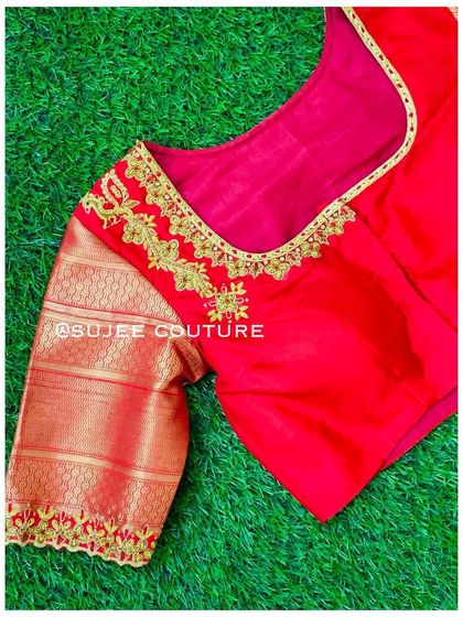 A simple yet elegant red blouse with gold silk sleeves. The sweetheart neckline and sleeve cuffs are highlighted with a delicate line of gold embroidery.