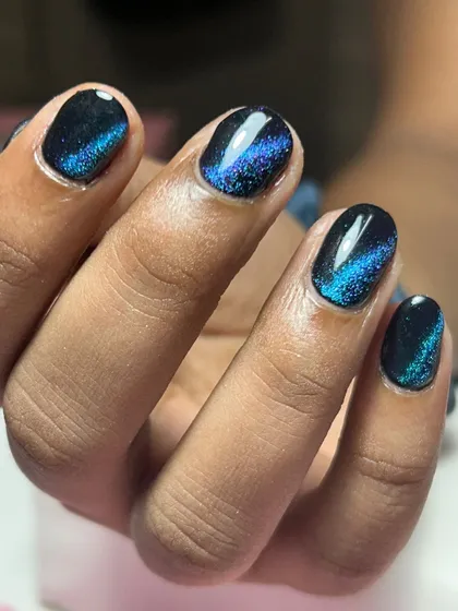 A close-up view of the magnetic shimmer in this cat-eye polish. You can really see the depth of the glitter and the sharp line created by the magnet.