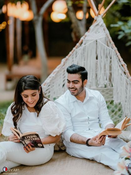 A casual and fun pre-wedding shoot with a picnic theme. The makeup is natural and fresh, perfect for a relaxed, daytime setting.