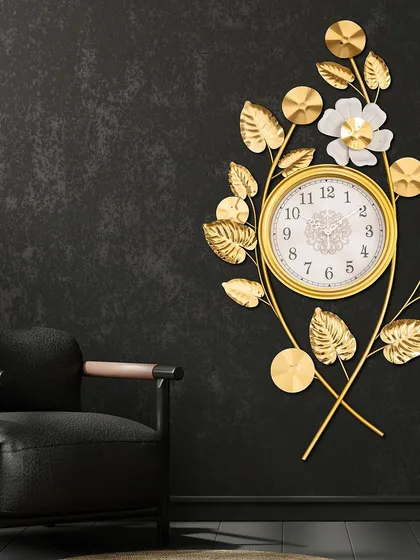 This unique piece combines a clock with floral metal art. The golden leaves and a single white flower gracefully surround the clock face, blending functionality with beautiful, nature-inspired design.