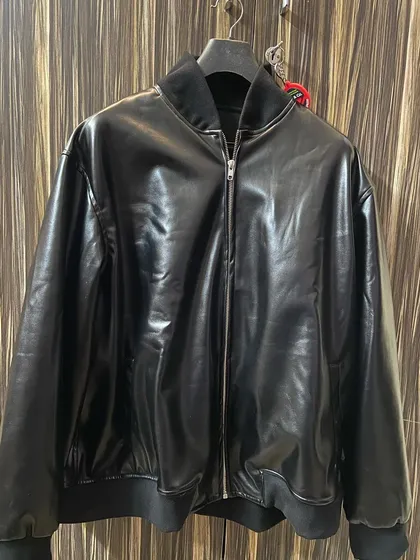 A full view of the custom black bomber jacket. I can tailor this style in various materials and colors to match your specific request.