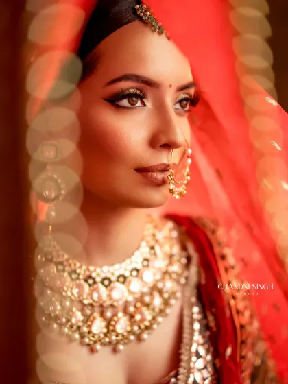 An artistic shot of the bridal makeup demo, focusing on the winged eyeliner and flawless skin. I teach students how to create looks that are not only beautiful but also photograph perfectly.