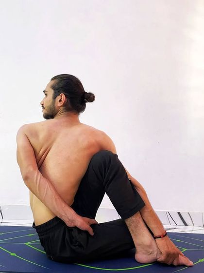 The full expression of Ardha Matsyendrasana (Half Lord of the Fishes Pose) with a complete bind.