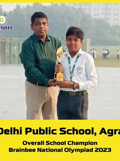 A trophy winner from Delhi Public School, Agra, recognized for his excellent performance in the 2023 Olympiad.