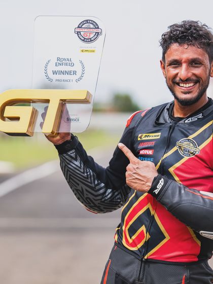 A close-up of Anish Shetty with his winner's trophy, a testament to his skill and the performance of the team.
