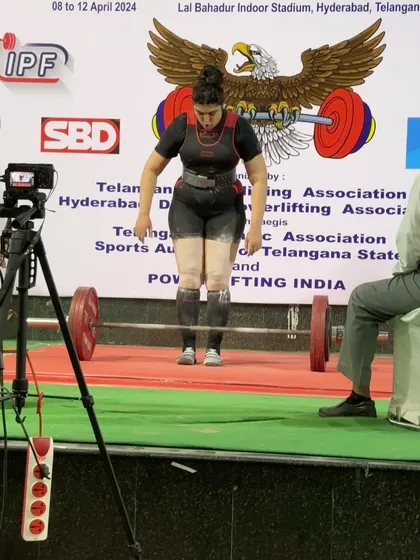 Pooja preparing for her deadlift. This lift is the culmination of a year of navigating her health issues. Many doctors told her to stop lifting heavy, but we found a way to make her stronger and healthier.
