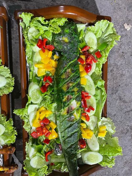 A beautifully presented grilled fish, marinated in a green herb paste and cooked to flaky perfection. A healthy and delicious option for any menu.