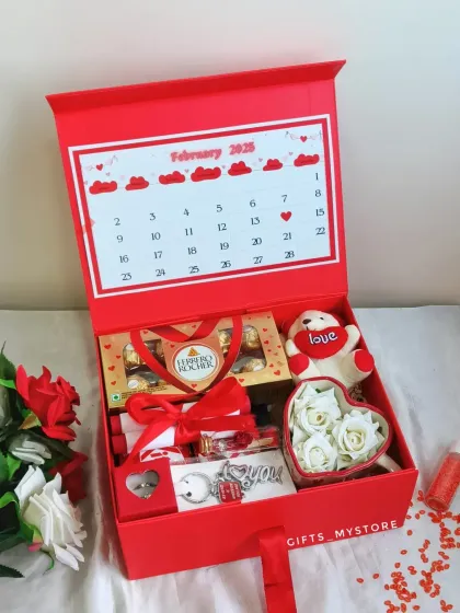 A gift like this for Valentine's is everything! This specially curated hamper includes a personalized calendar, Ferrero Rocher, and a heart-shaped box of roses.