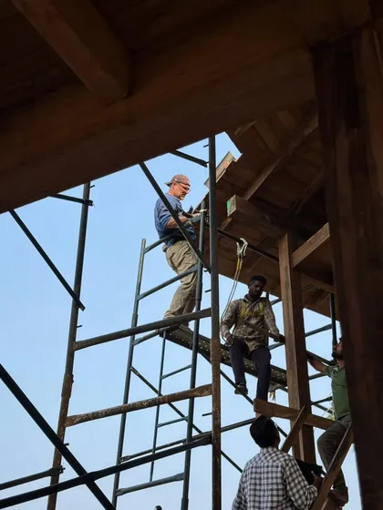Our team on the scaffolding, working out the timber roofing details. This hands-on, collaborative approach ensures that every joint is perfect and every design challenge is met with a practical solution.