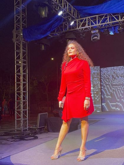 Posing on the ramp after the show. My experience in fashion events gives me practical, real-world insights that I bring to my personal styling and confidence coaching clients.