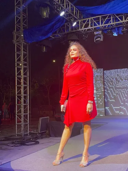Posing on the ramp after the show. My experience in fashion events gives me practical, real-world insights that I bring to my personal styling and confidence coaching clients.
