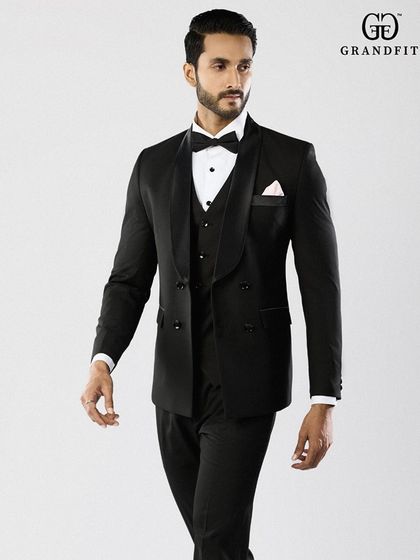 Our double-breasted tuxedo offers a bold, confident statement. The six-button front and broad lapels create a distinctive silhouette that speaks to a classic, yet assertive, sense of style.