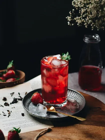 Love for all things red. This moody shot of a strawberry iced tea was inspired by the show Drink Masters. The dark background makes the red of the drink pop.