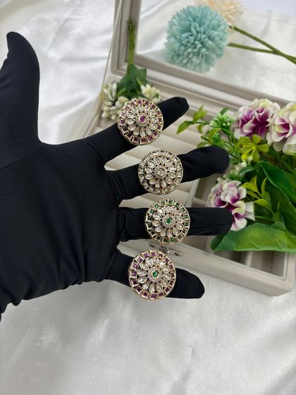 A collection of our traditional circular Kundan rings. These adjustable rings are available in multiple color combinations, including green, red, and all-white, making them a great impulse buy for customers.